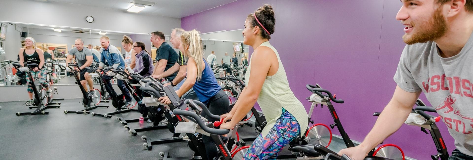 people in a spin fitness class