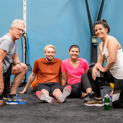group of people smiling after a workout