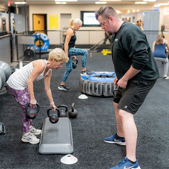 personal trainer and a client in a modern gym in Janesville